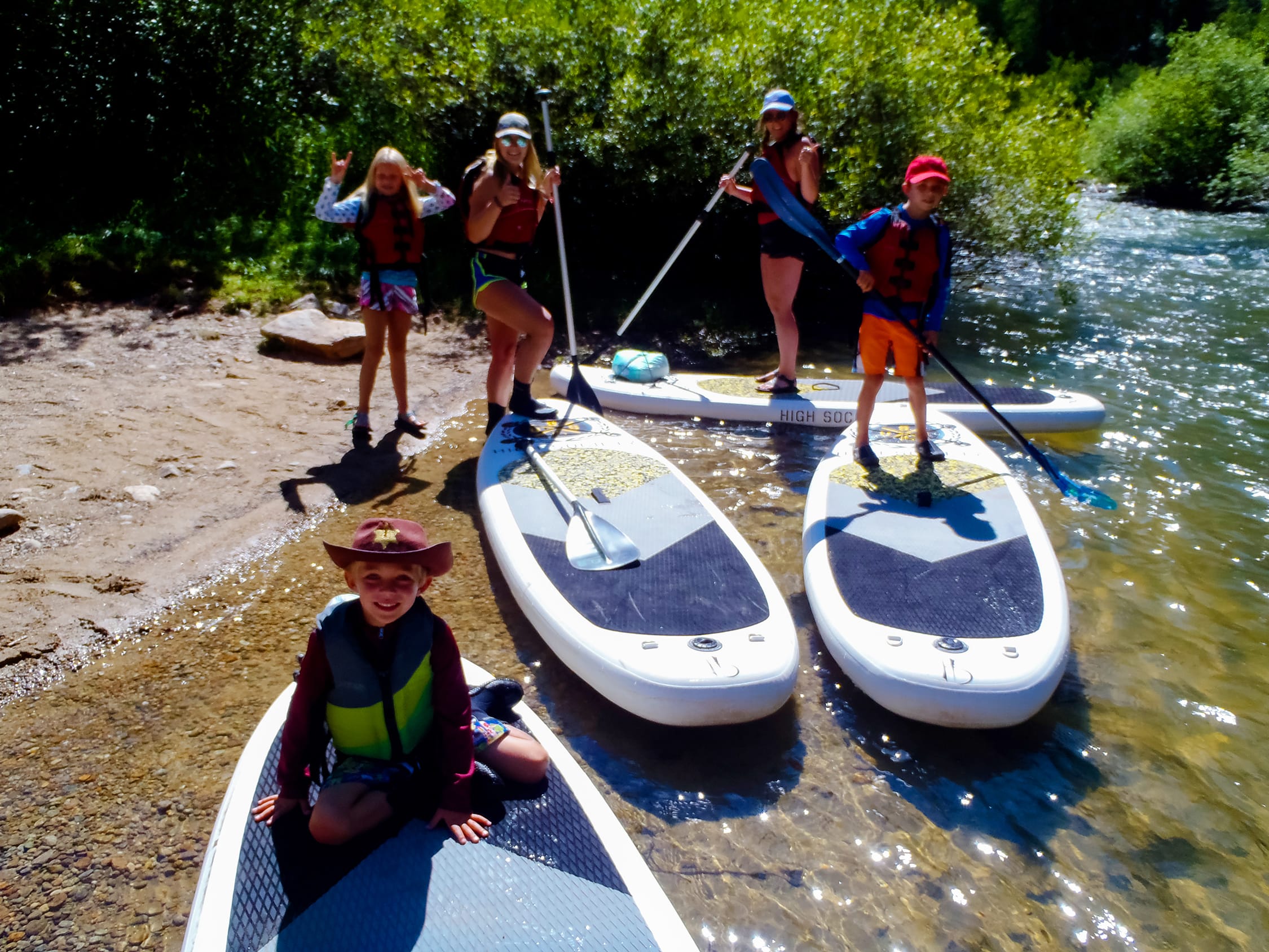 a group of people on stand up paddle board rentals in Aspen