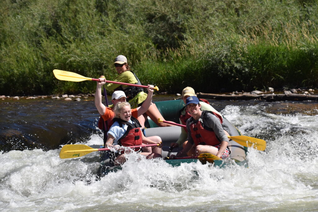 a group rafting on the Middle Roaring Fork River