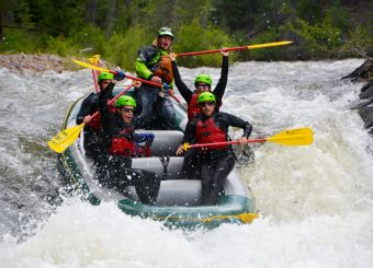 group of rafters on a whitewater raft trip going over Slaughterhouse Falls