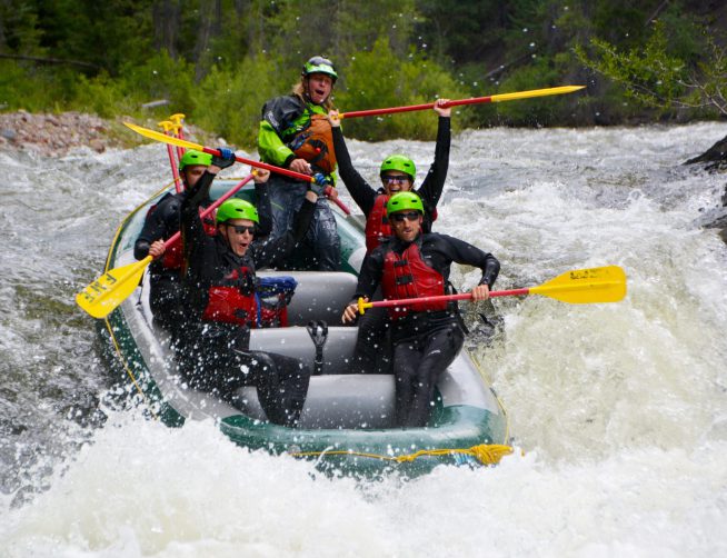 group of rafters on a whitewater raft trip going over Slaughterhouse Falls